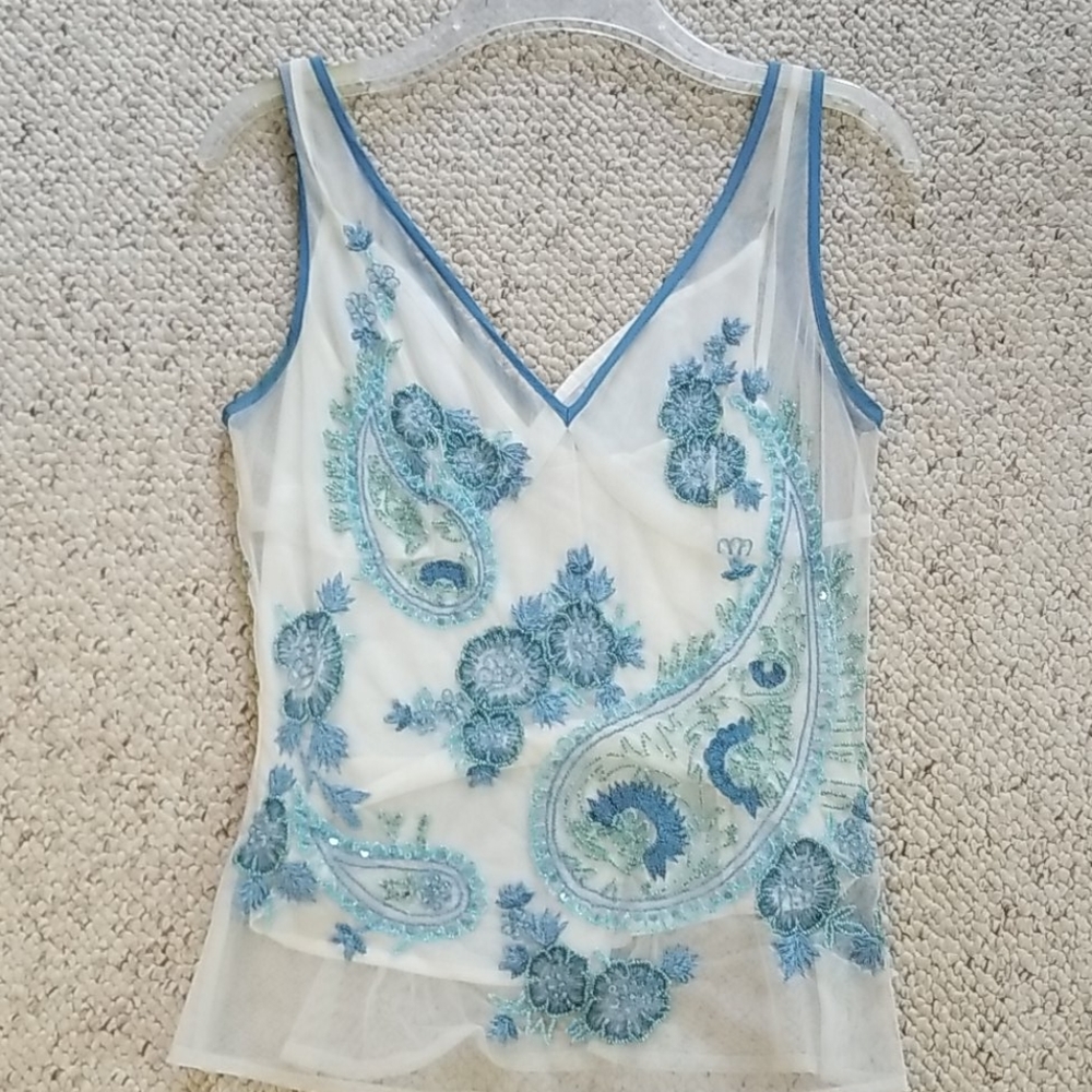 Sheer top embellished and sequined with white tank top underneath